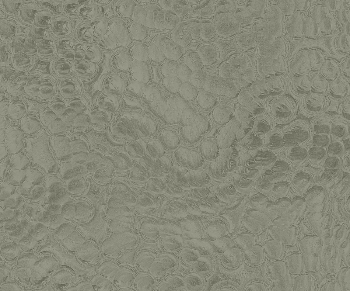 Textured green surface with circular patterns.