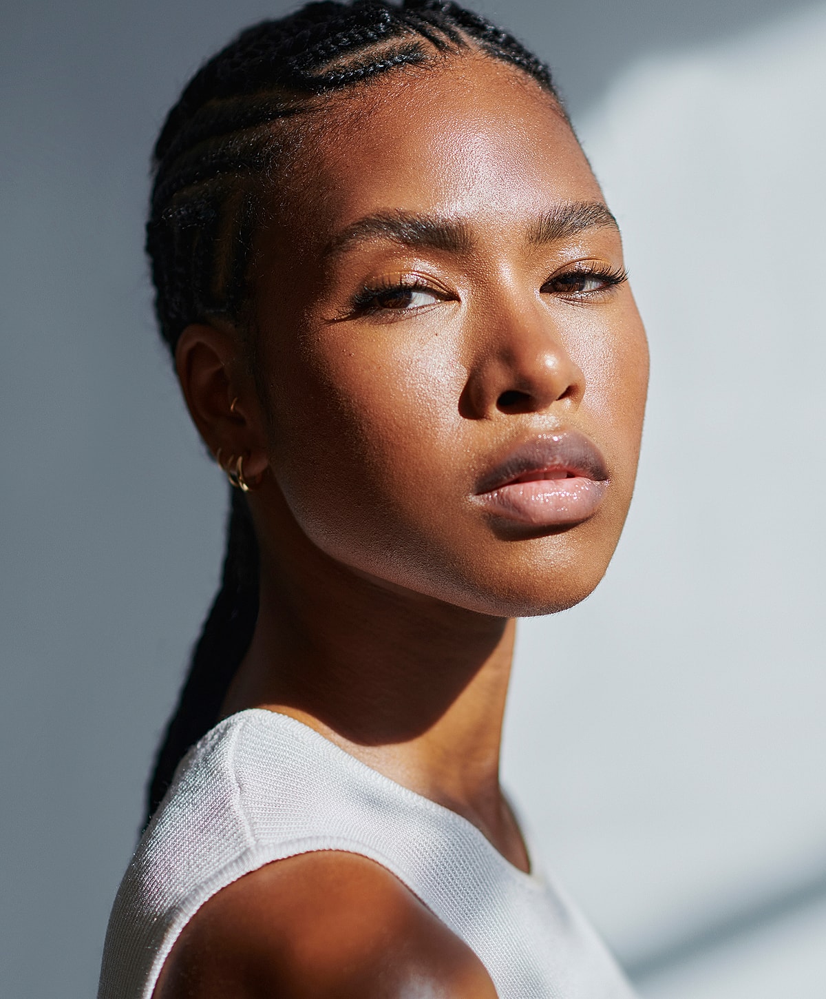 Portrait of a woman with braided hair.