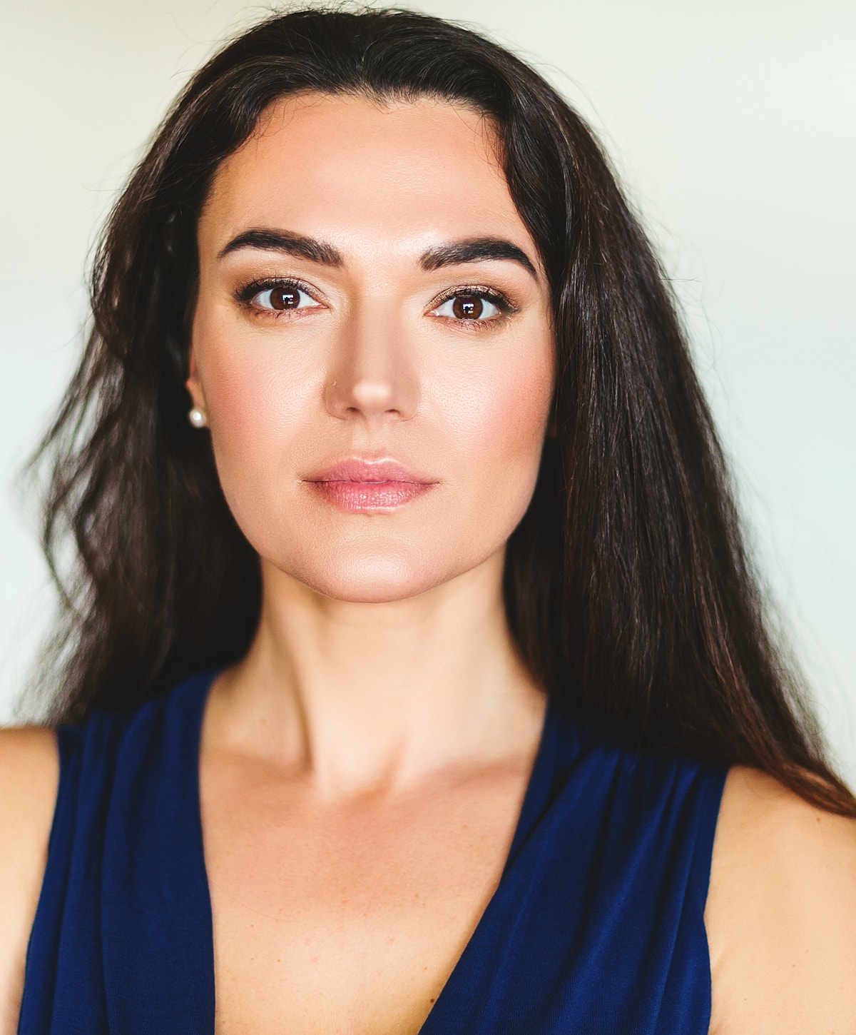 Close-up portrait of a confident woman.