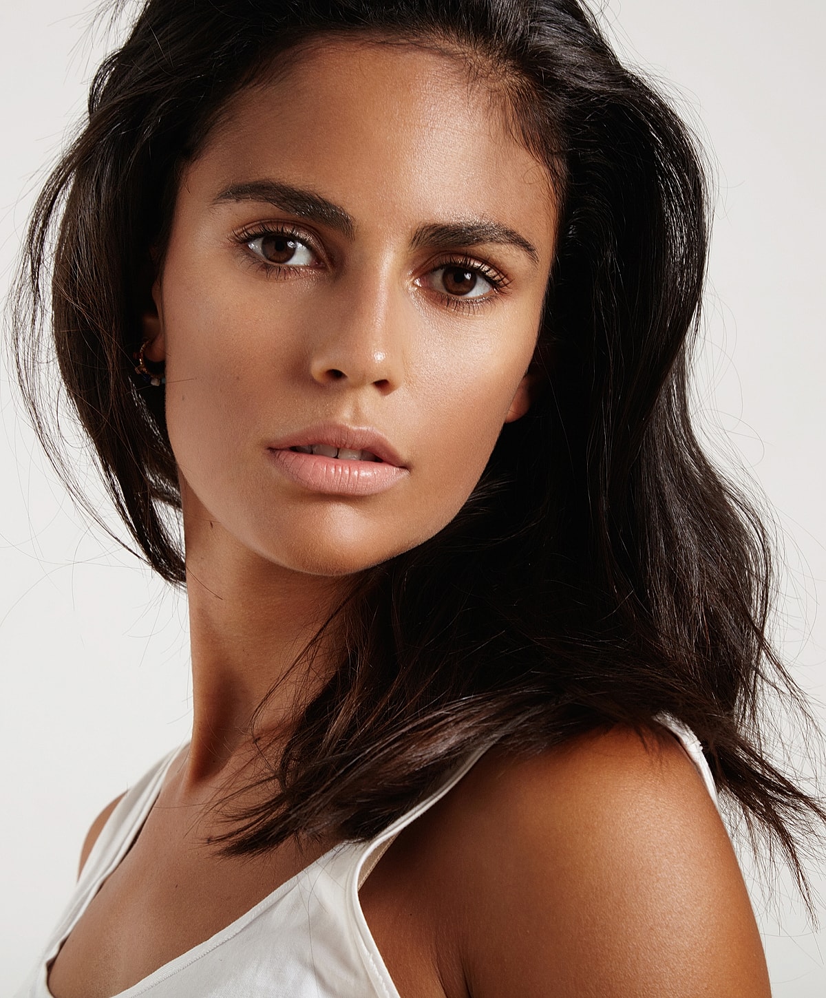 Portrait of woman with long dark hair.