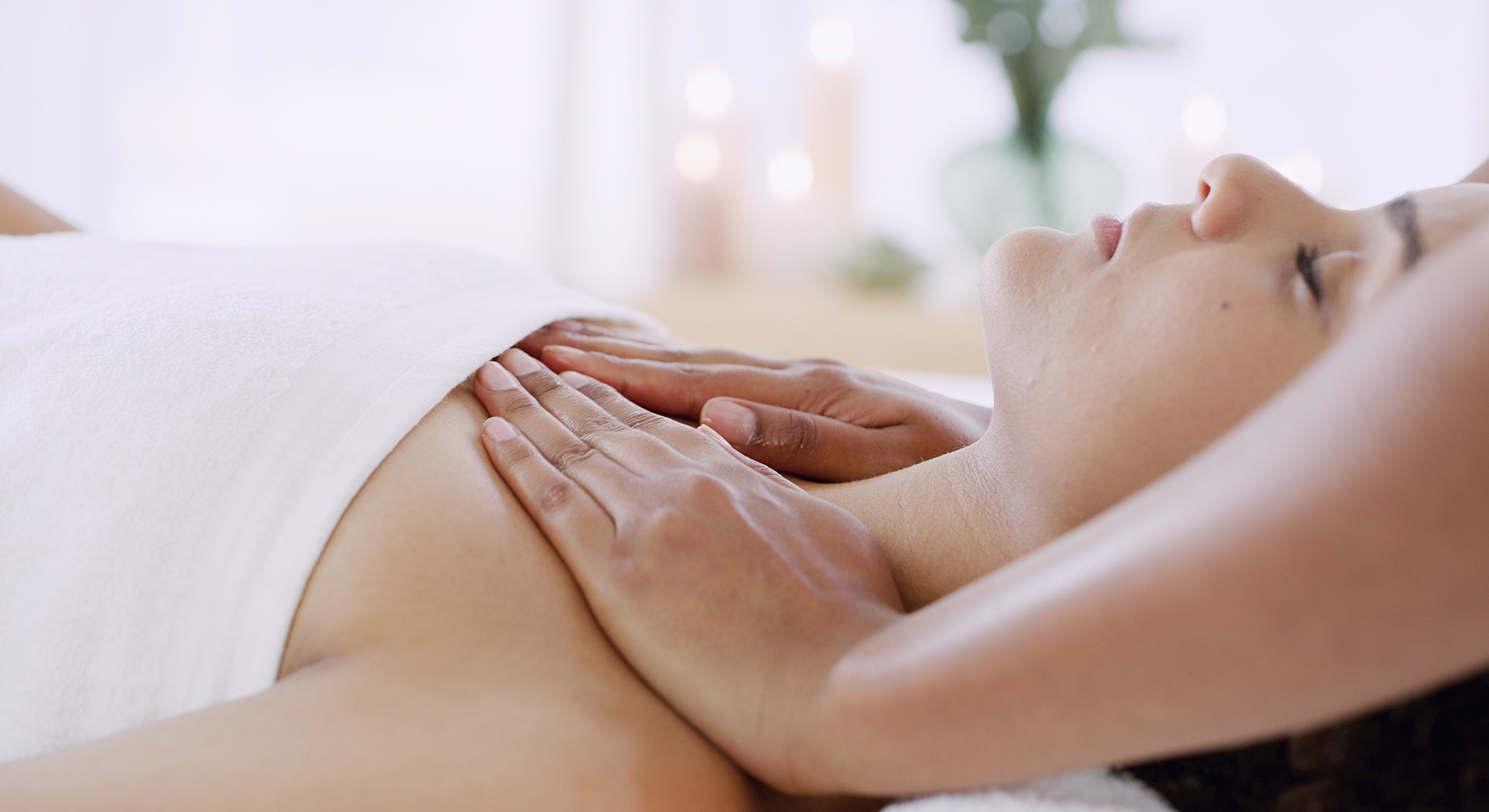 Massage therapy with relaxing atmosphere and soft lighting.